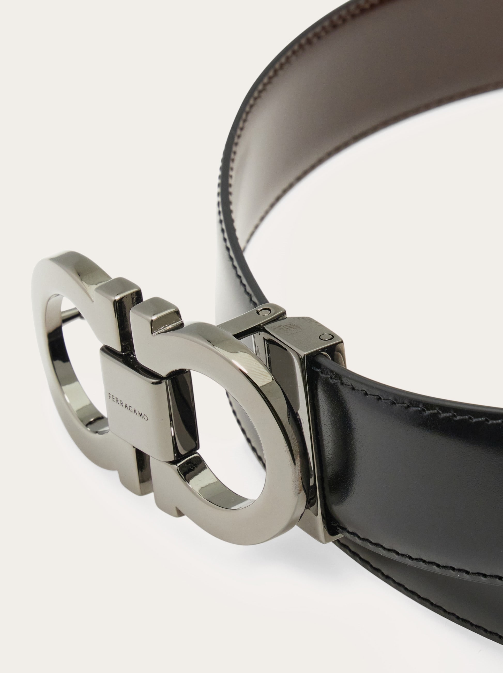 Reversible and adjustable Gancini belt - Men | Ferragamo