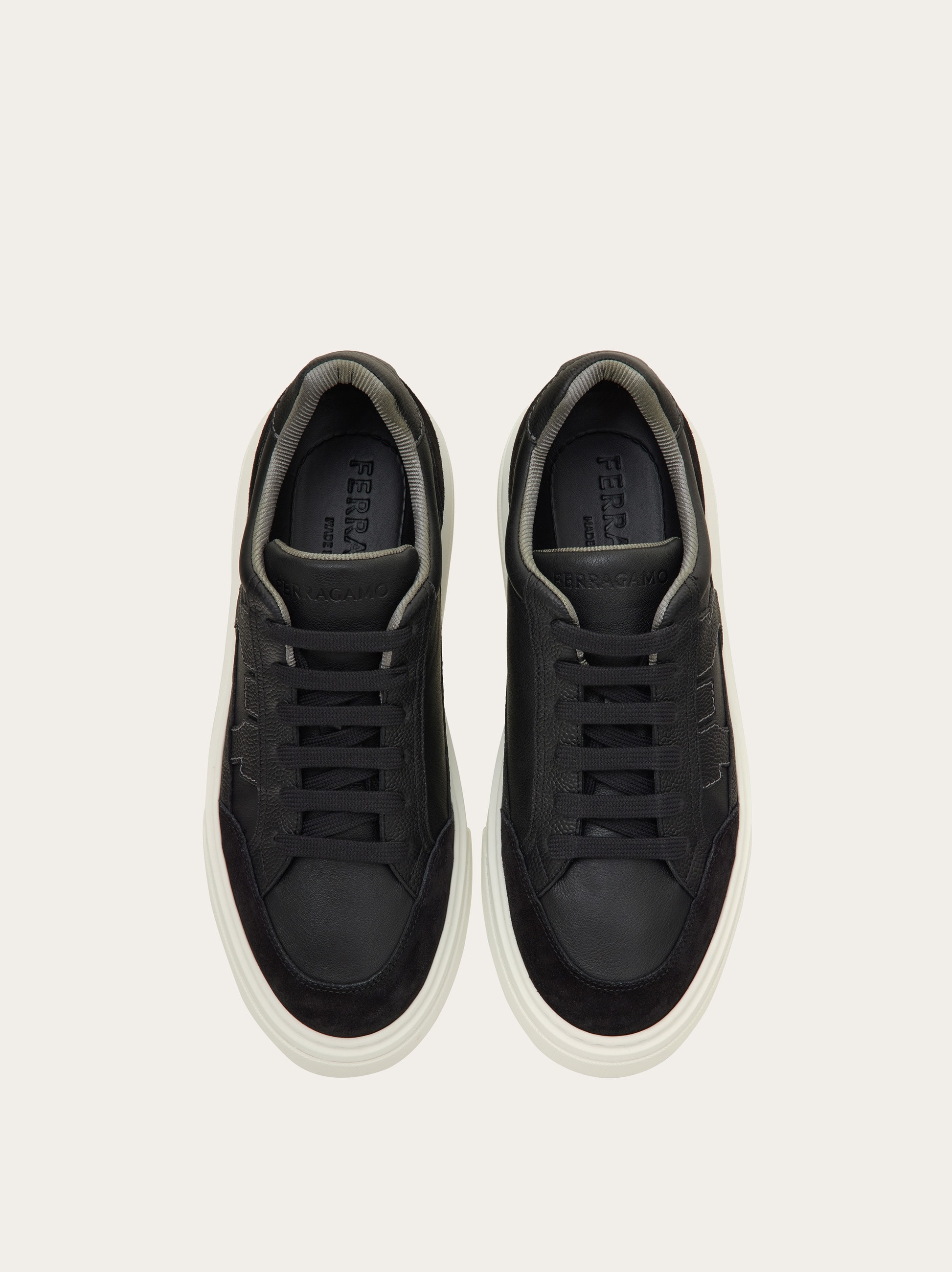 Low-top sneaker with Gancini detail - Men | Ferragamo