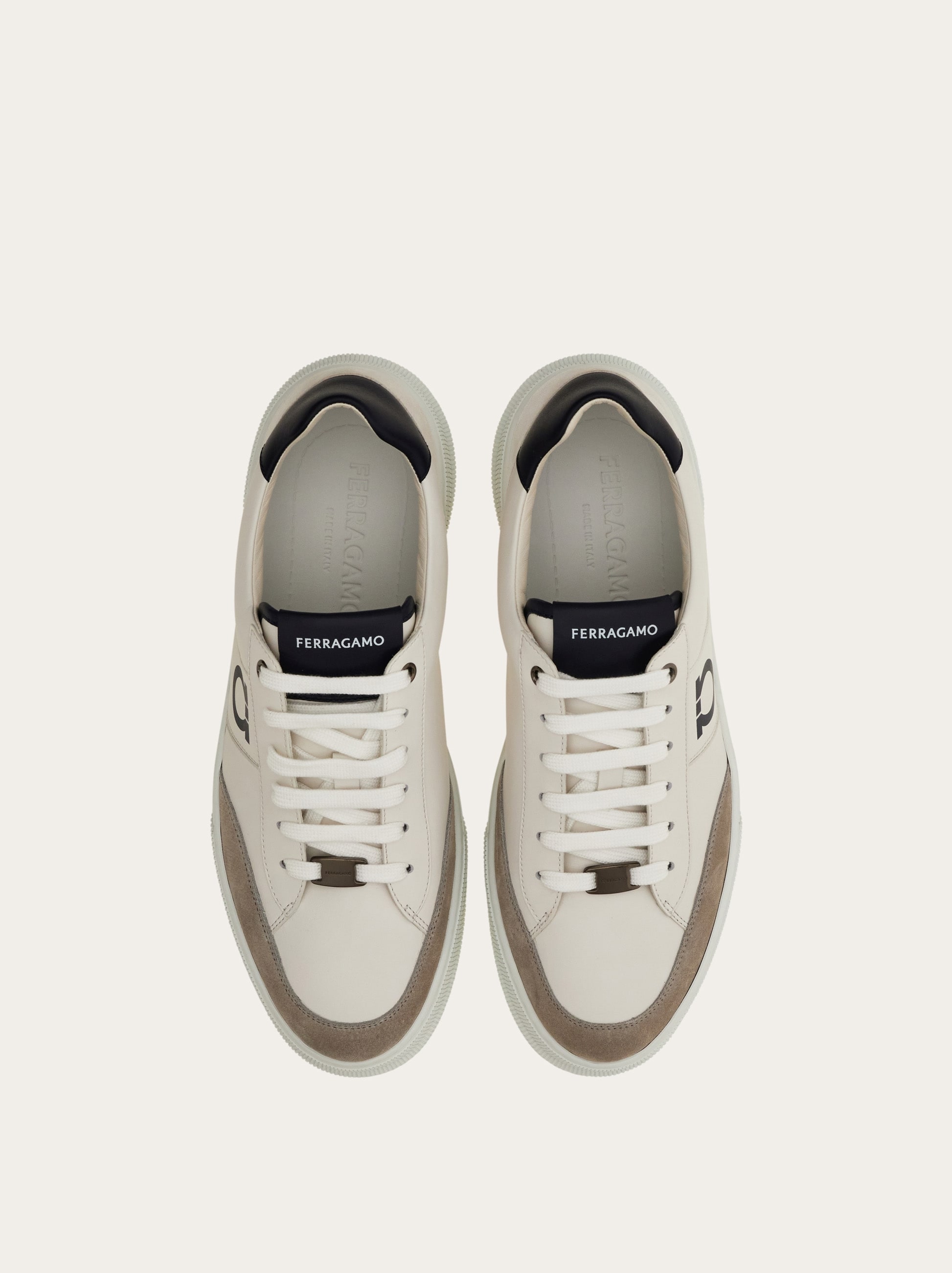 Low-top sneaker with Gancini detail - Men | Ferragamo