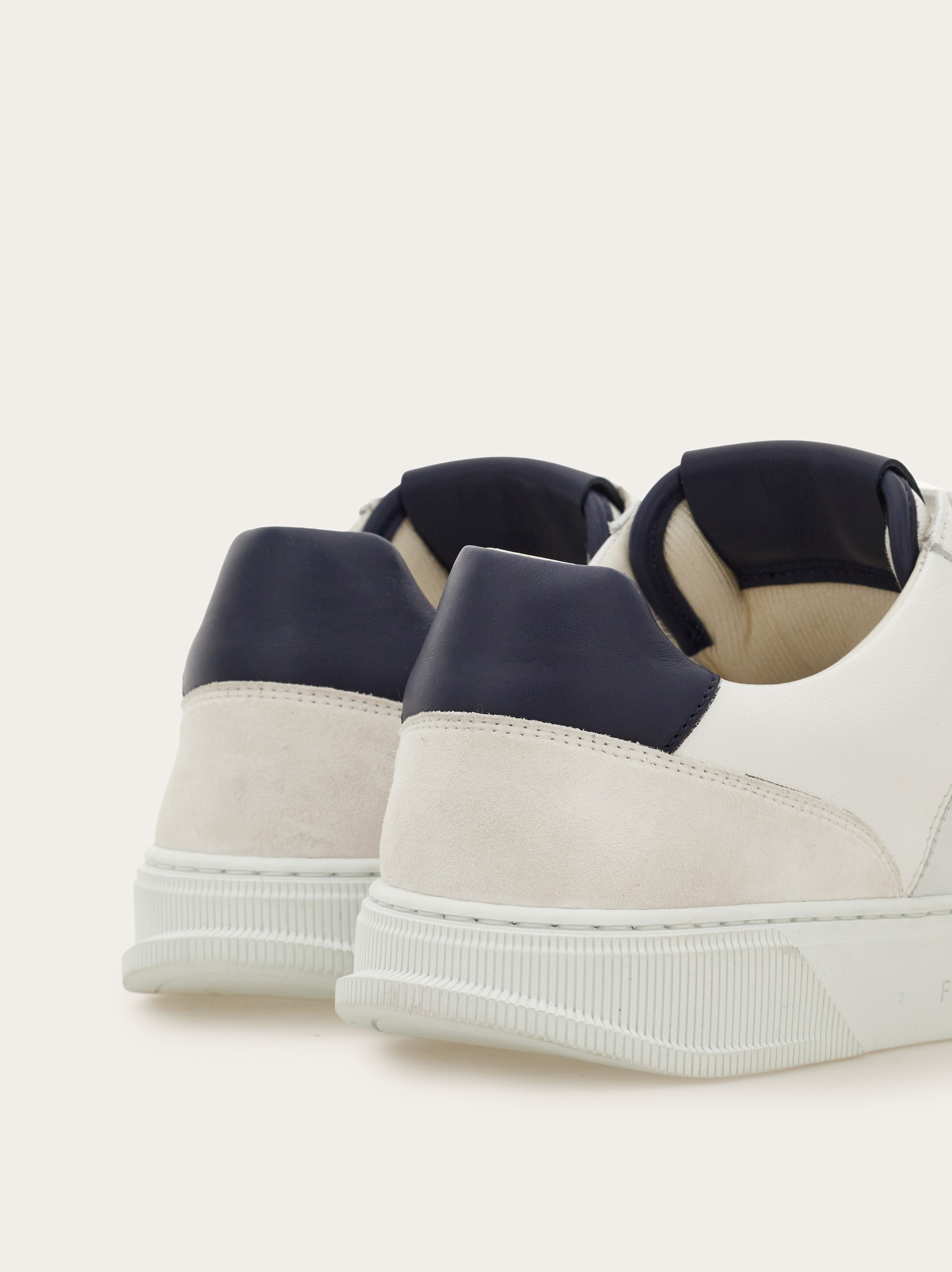 Low-top sneaker with Gancini detail - Men | Ferragamo