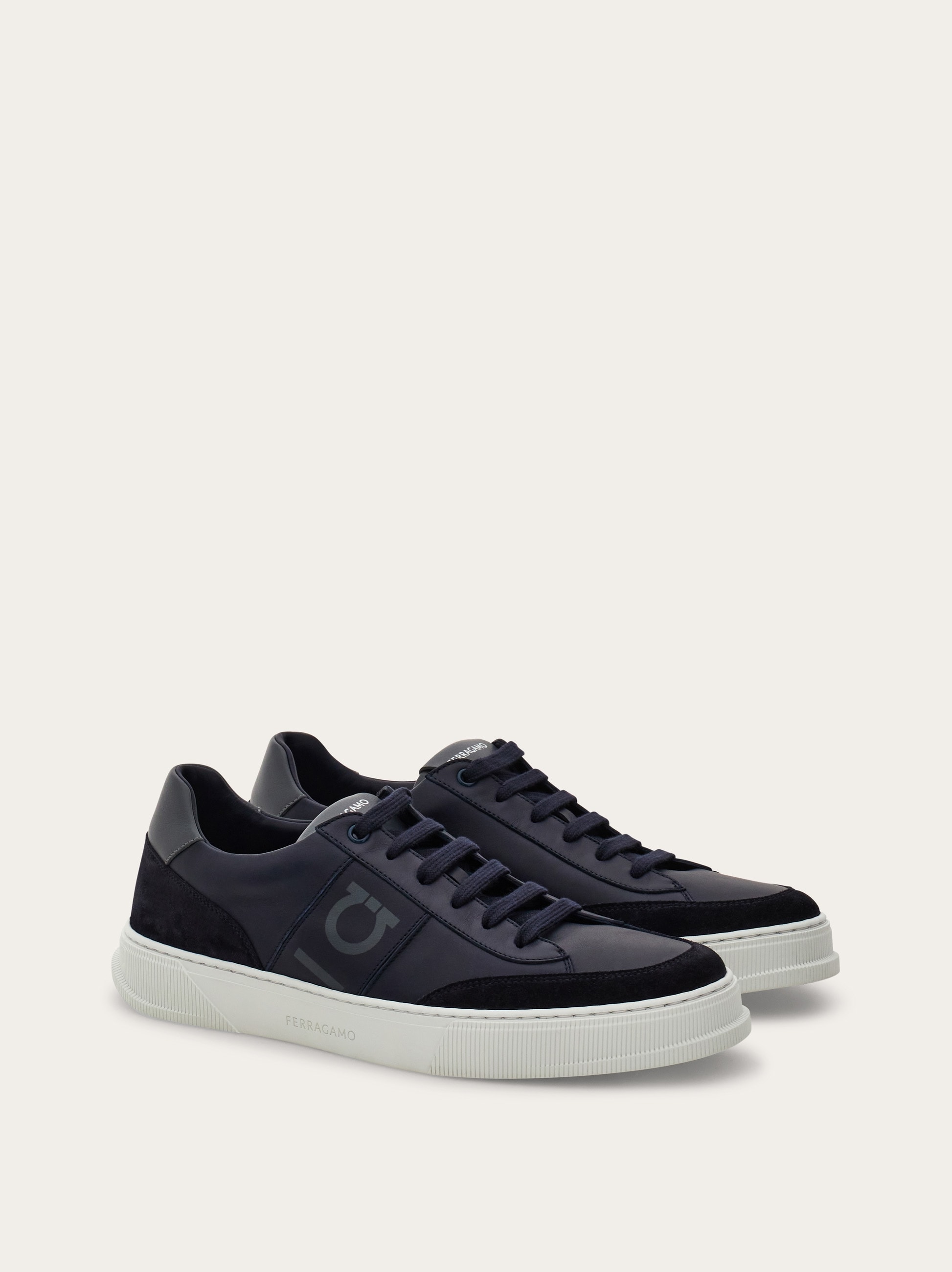 Low-top sneaker with Gancini detail - Men | Ferragamo