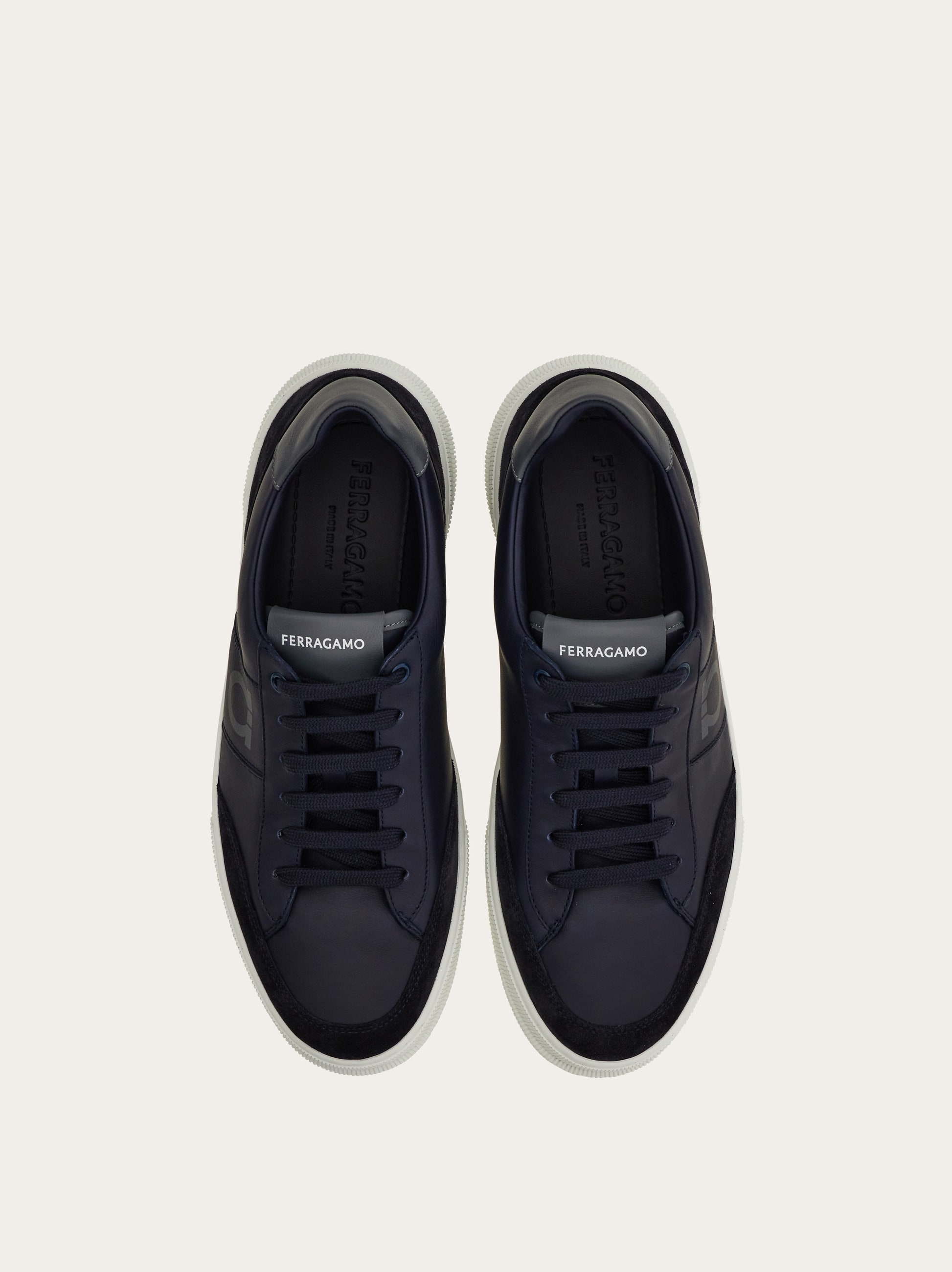 Low-top sneaker with Gancini detail - Men | Ferragamo