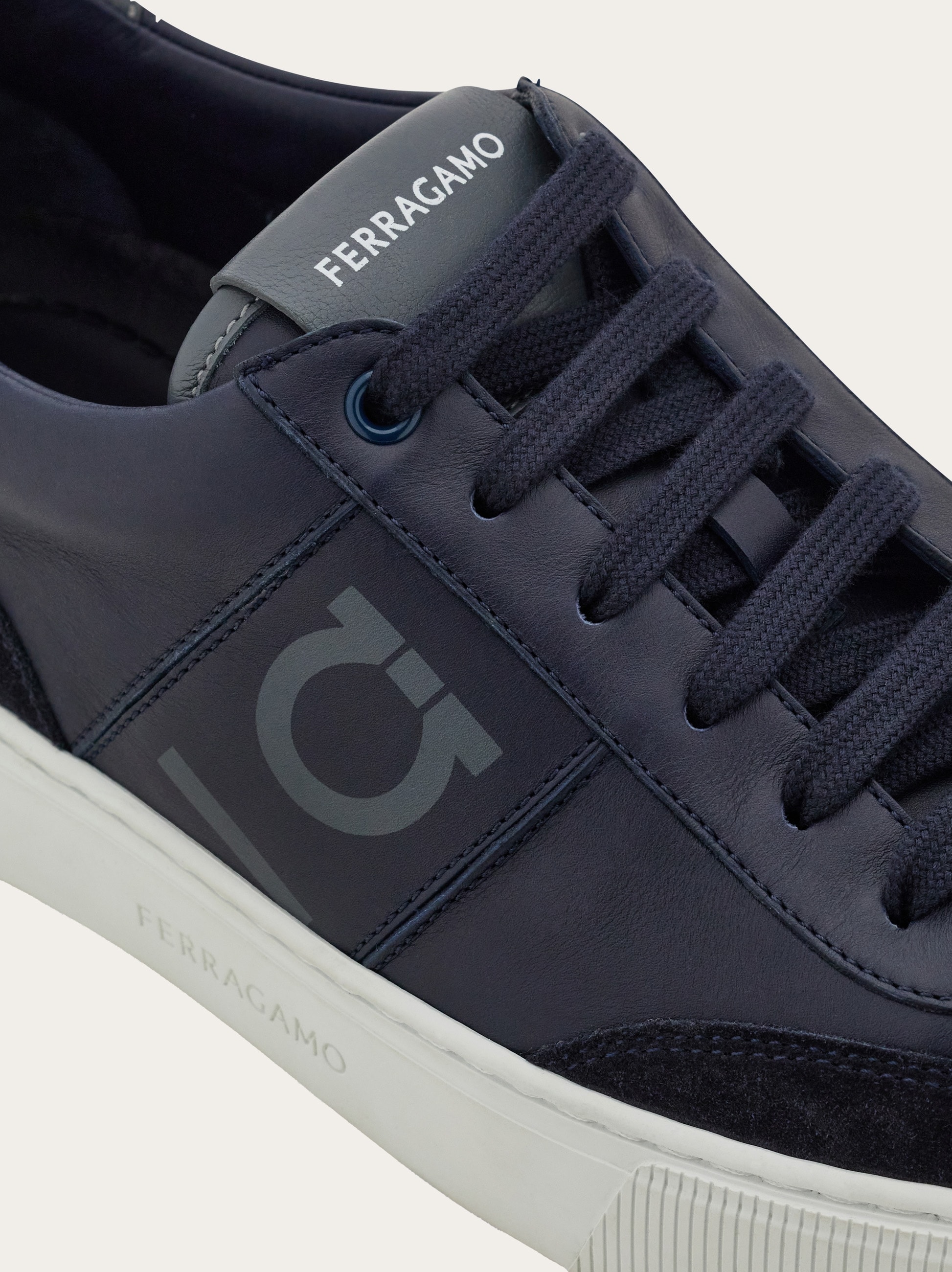 Low-top sneaker with Gancini detail - Men | Ferragamo