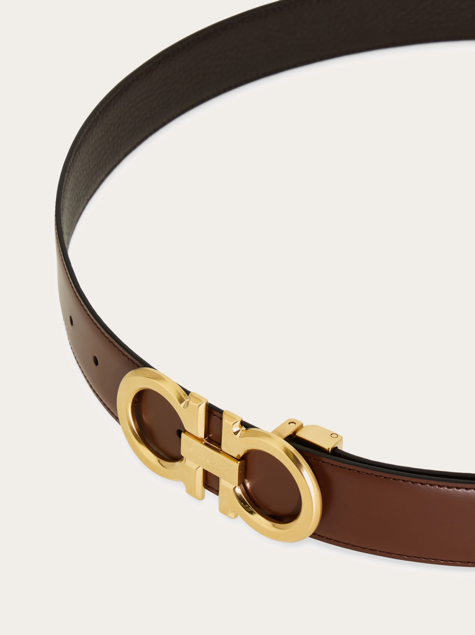 Reversible and adjustable Gancini belt - Men | Ferragamo