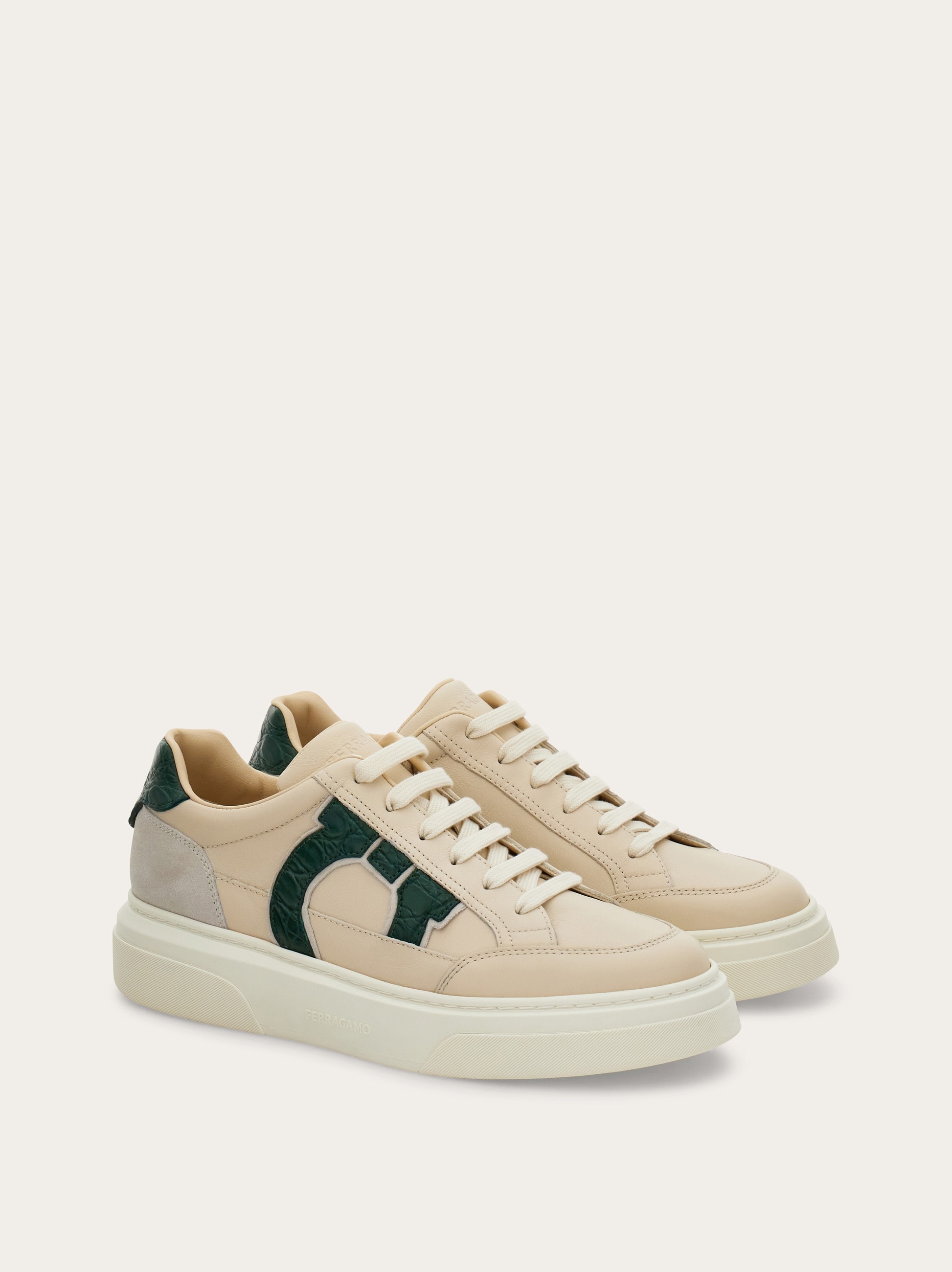 Low-top sneaker with Gancini detail - Men | Ferragamo