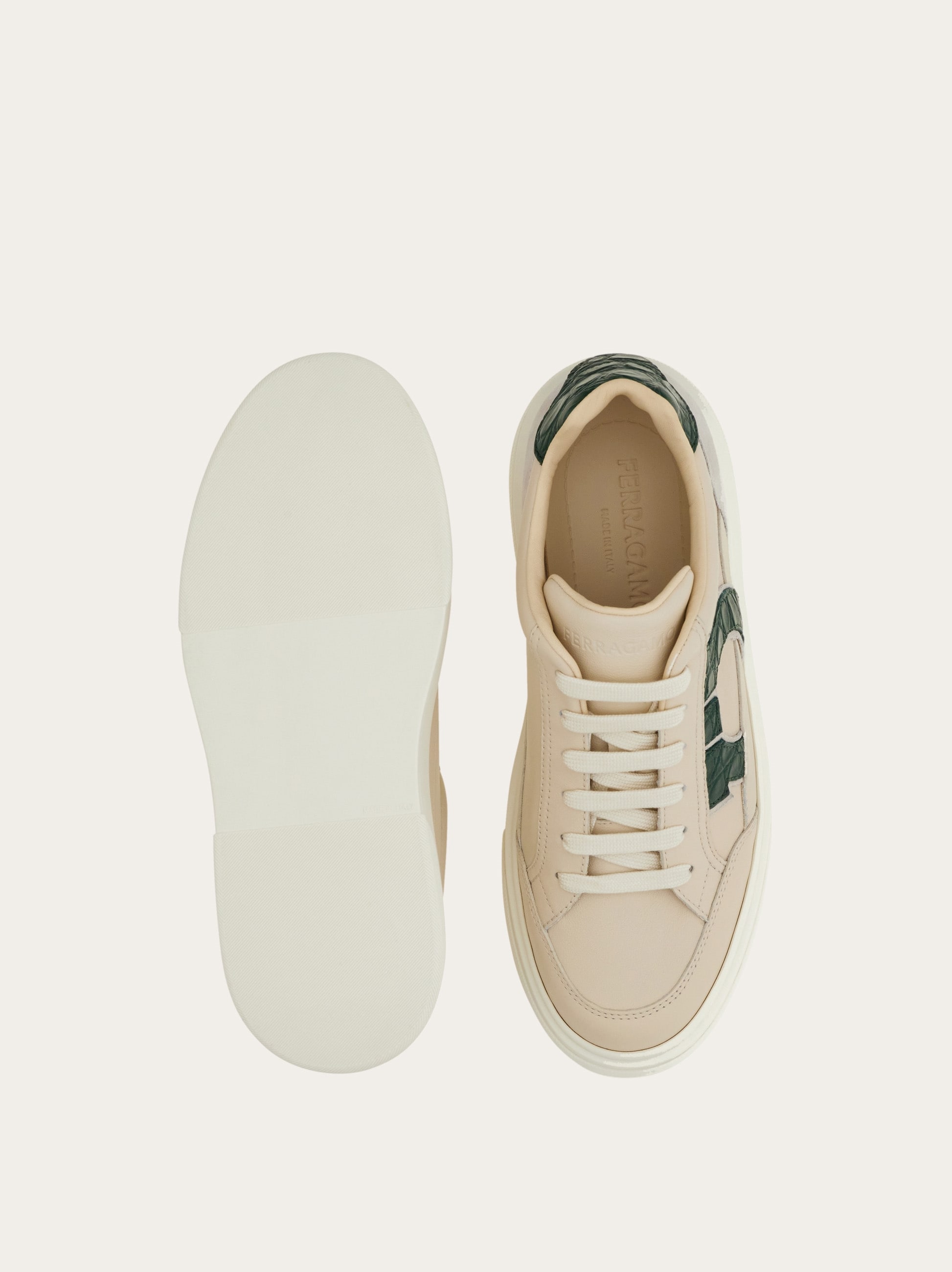 Low-top sneaker with Gancini detail - Men | Ferragamo