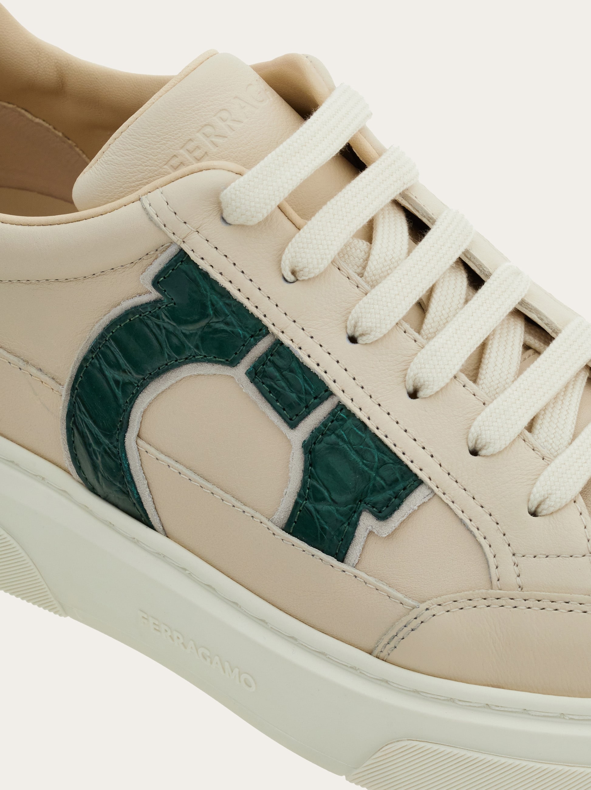 Low-top sneaker with Gancini detail - Men | Ferragamo