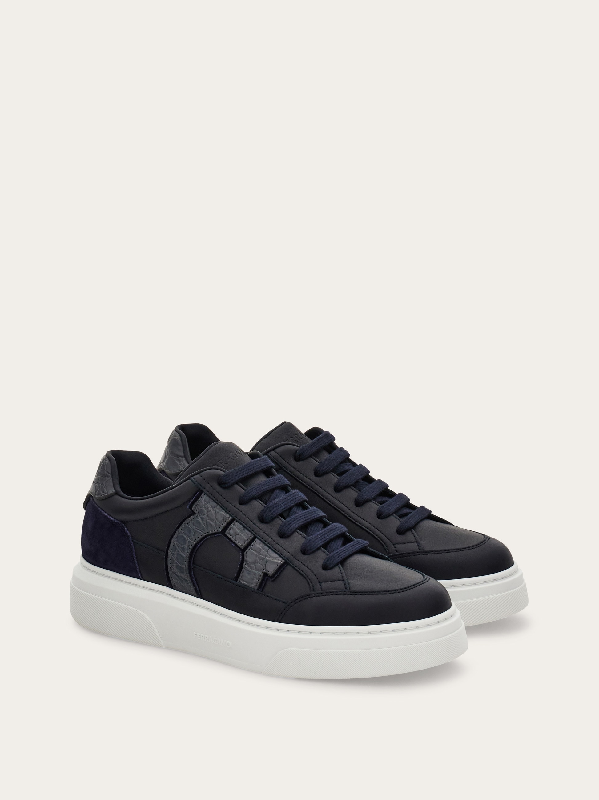 Low-top sneaker with Gancini detail - Men | Ferragamo