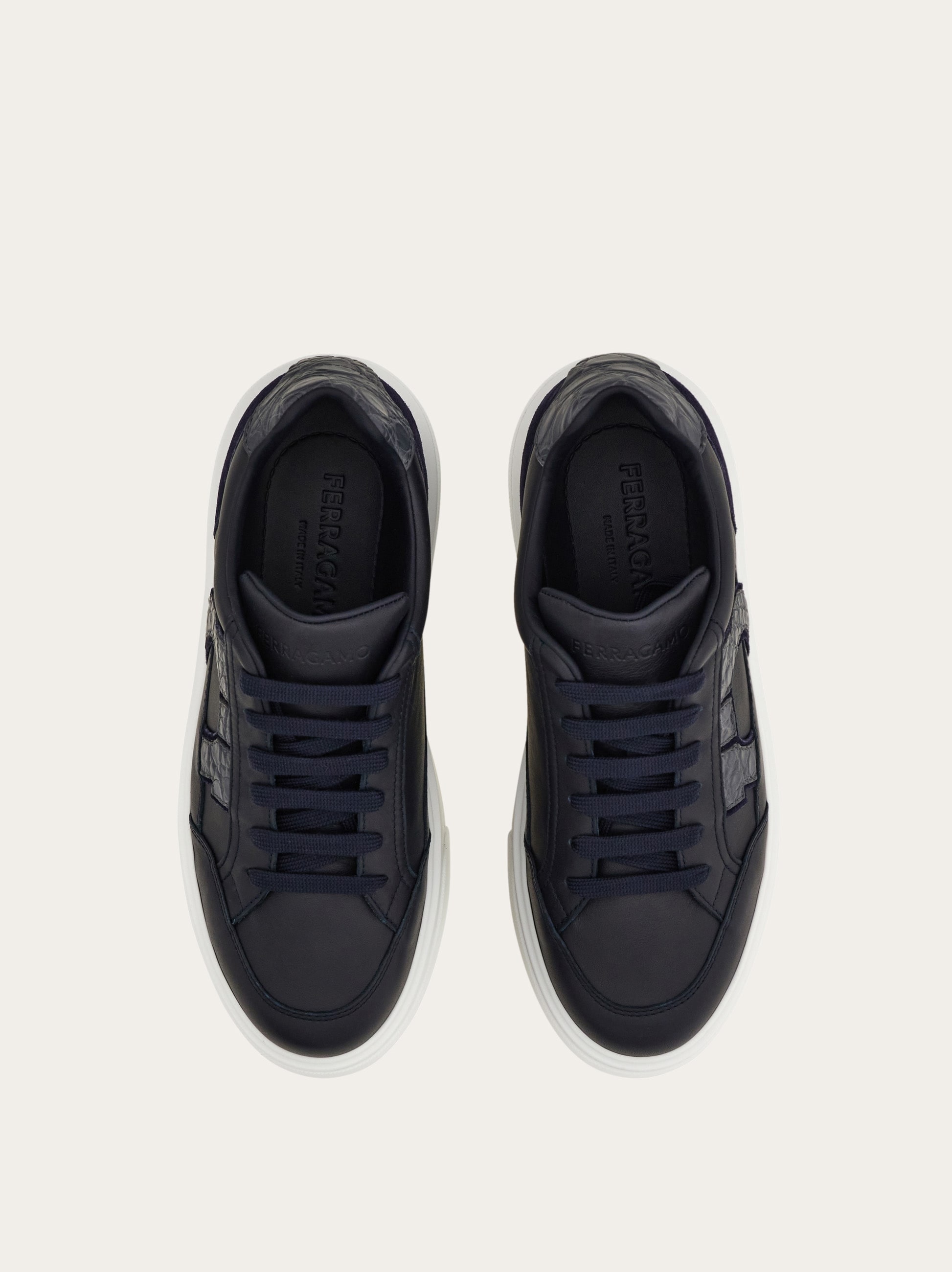 Low-top sneaker with Gancini detail - Men | Ferragamo