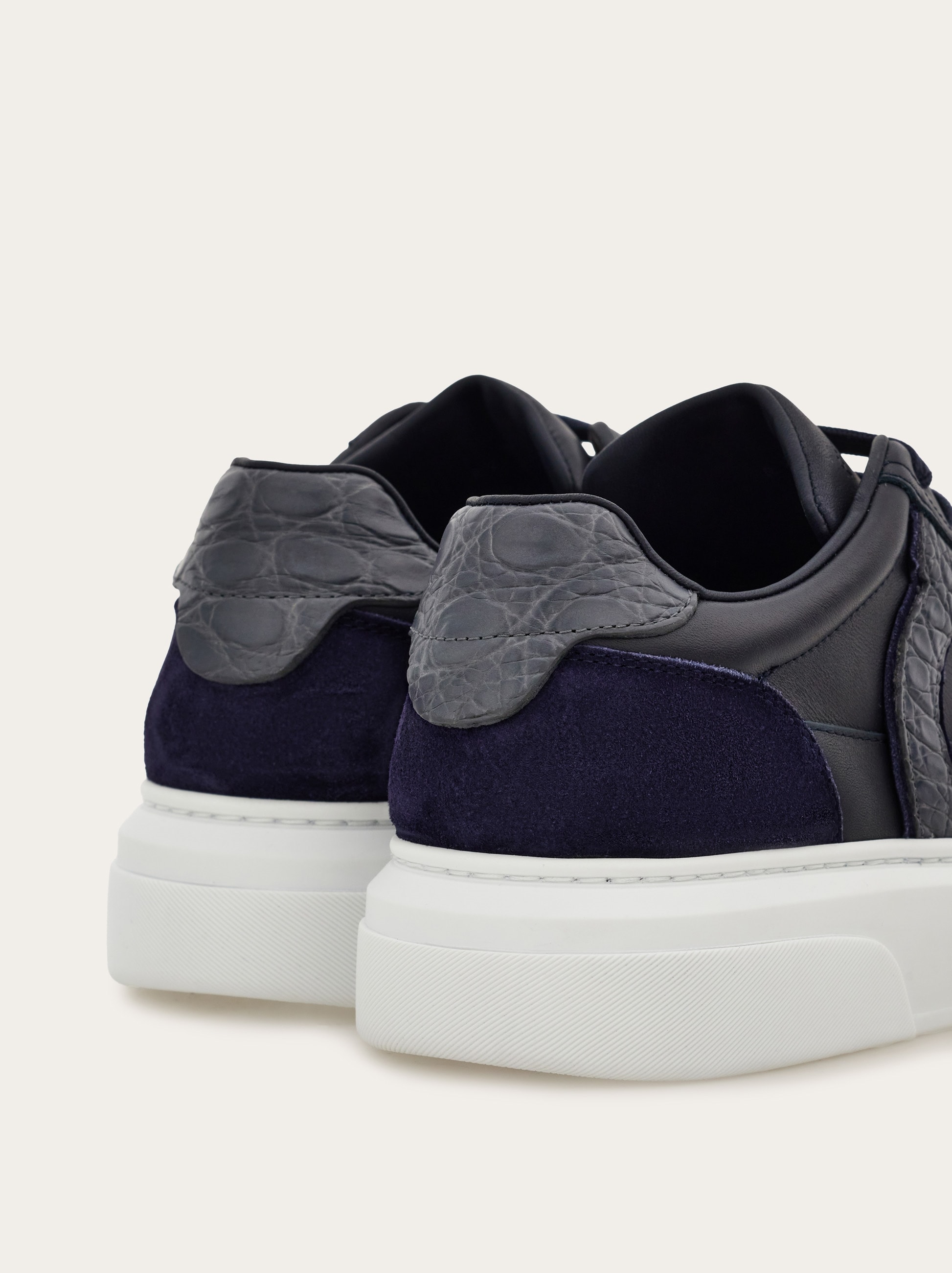 Low-top sneaker with Gancini detail - Men | Ferragamo