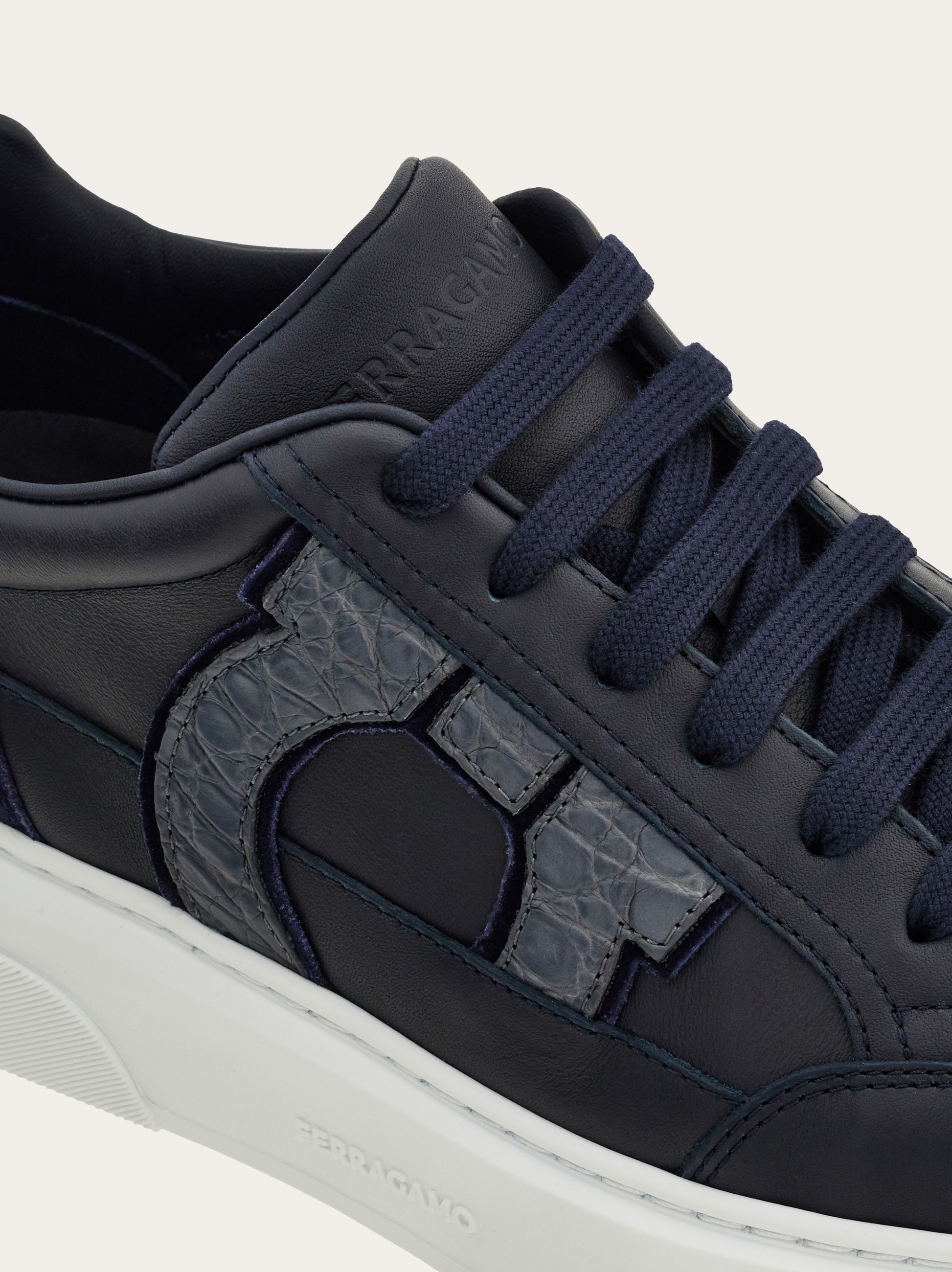 Low-top sneaker with Gancini detail - Men | Ferragamo