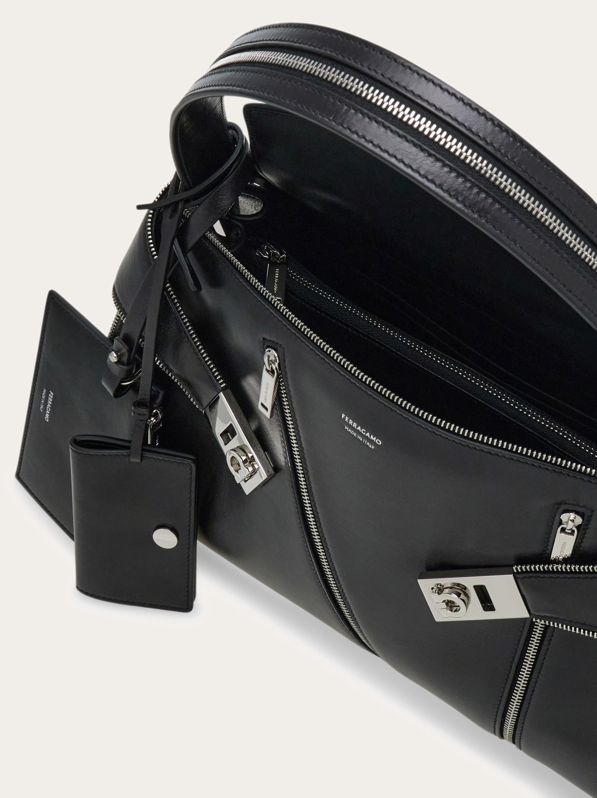 Hug soft shoulder bag multi-zip (M) - Women | Ferragamo