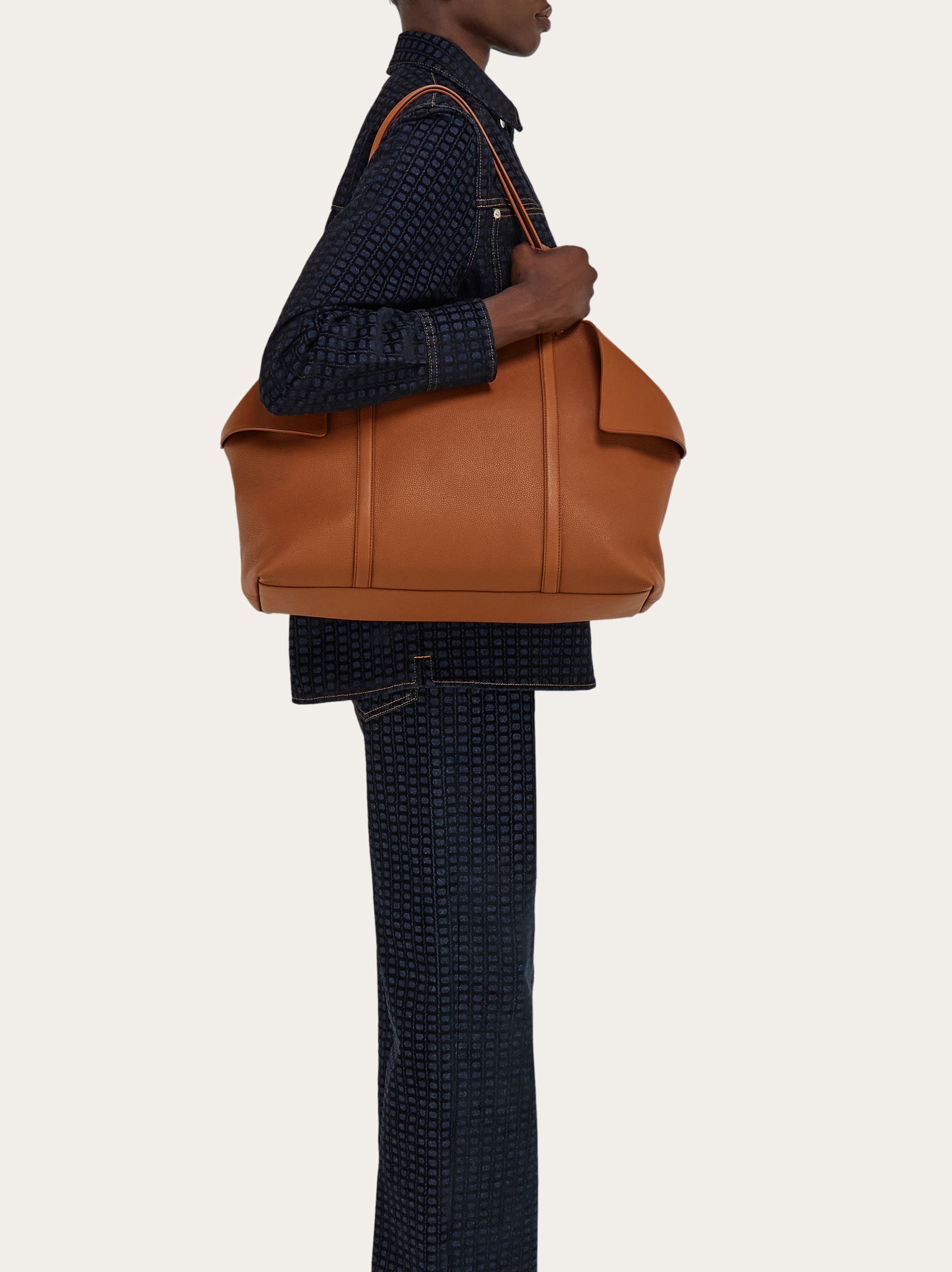 ferragamo travel leather tote bag | mini nude crafted from rich calfskin with leather lining that subtly peeks from the side folds for added depth and elegance Ferragamo Women Folded tote Bag