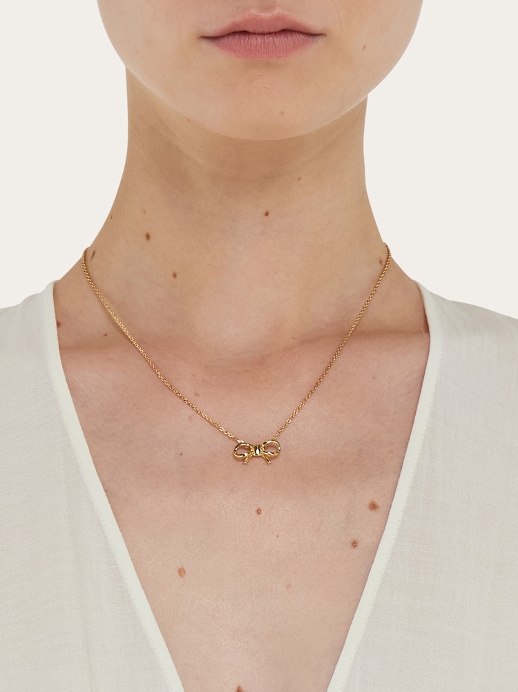 Necklace with bow pendant